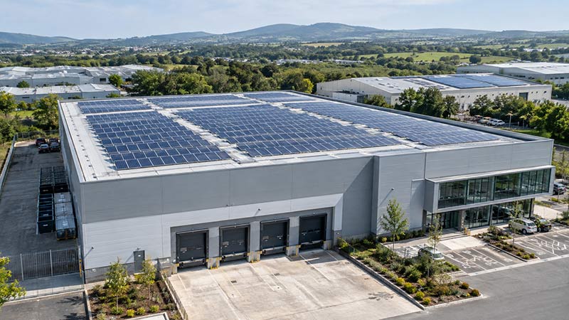Large commercial building in Ireland with solar panels installed across the roof